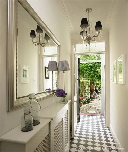 Mirror in a narrow hallway.